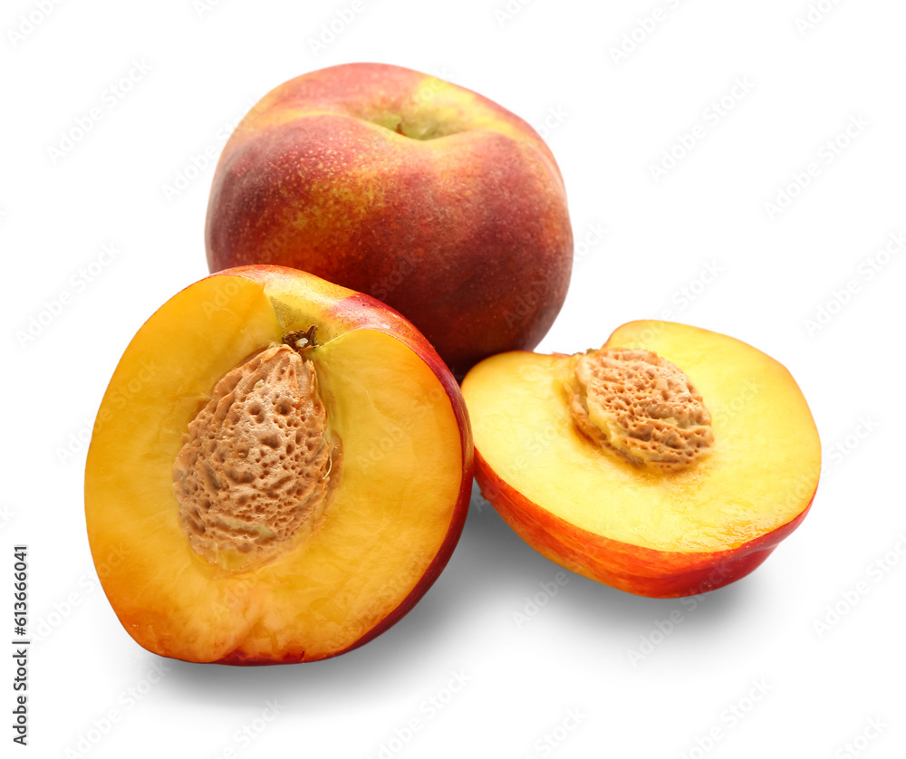 Halves of sweet peach on white background