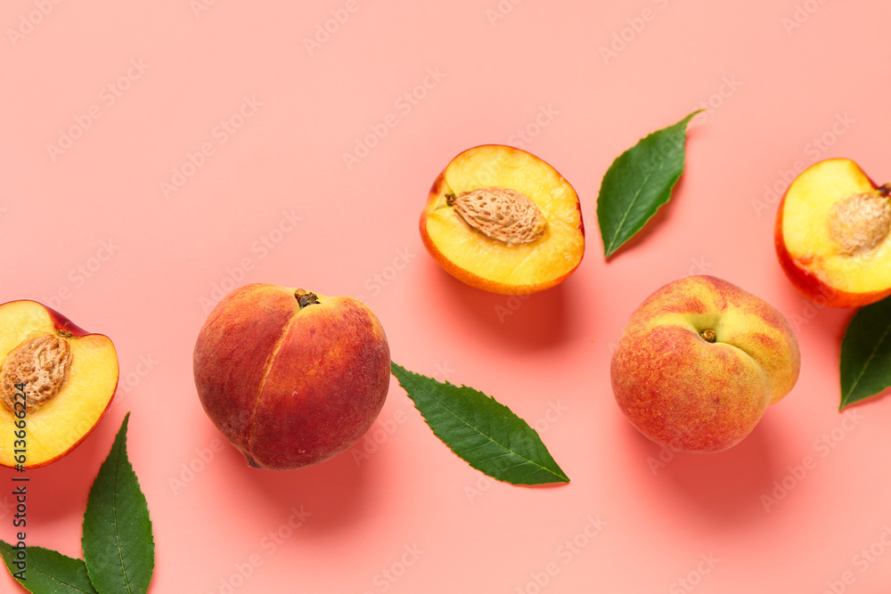 Sweet peaches and leaves on pink background