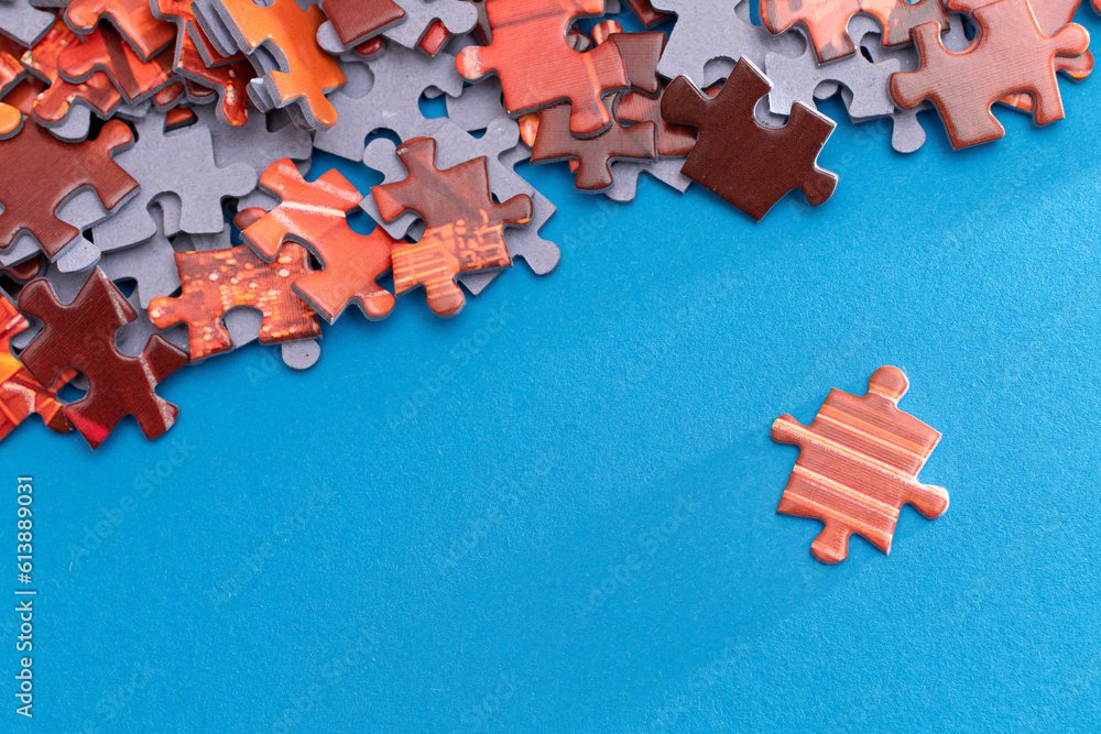 Mixed Peaces of a Colorful Jigsaw Puzzle Lie on the Blue Background - Strategy and Solving Problem C