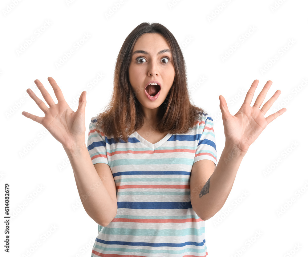 Shocked young woman showing hands on white background