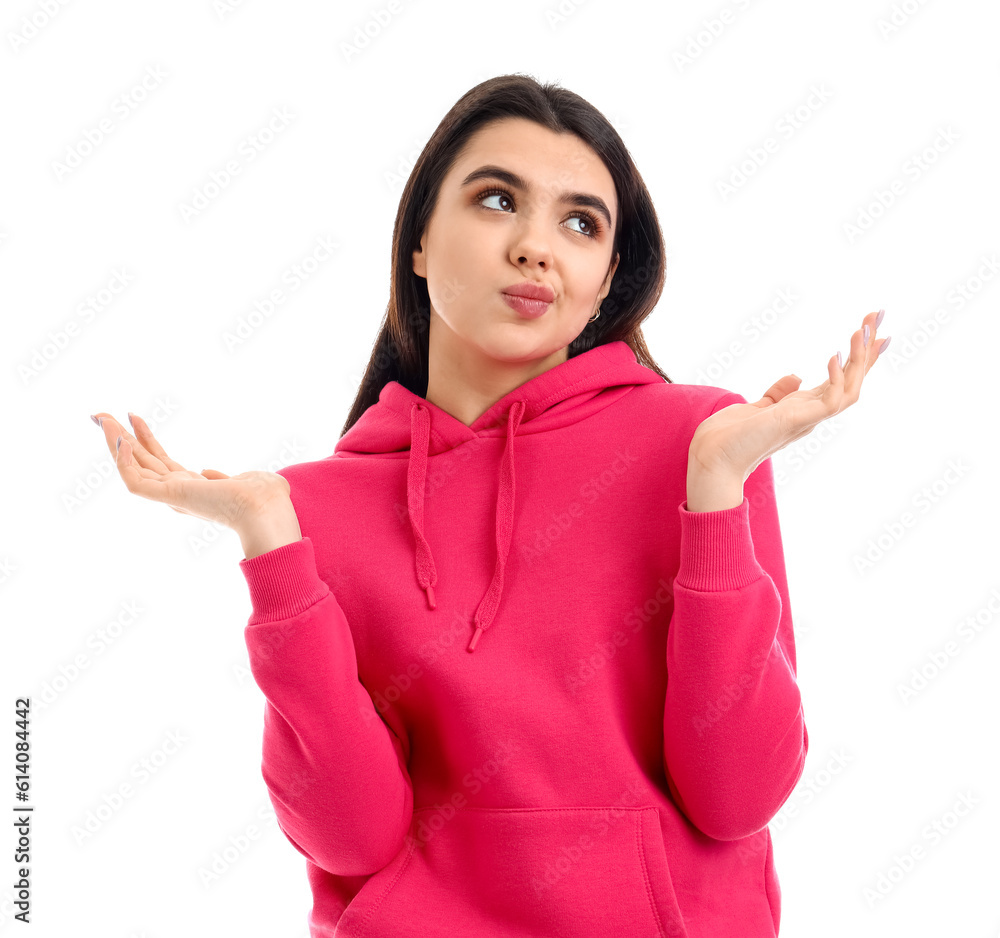 Confused young woman on  white background