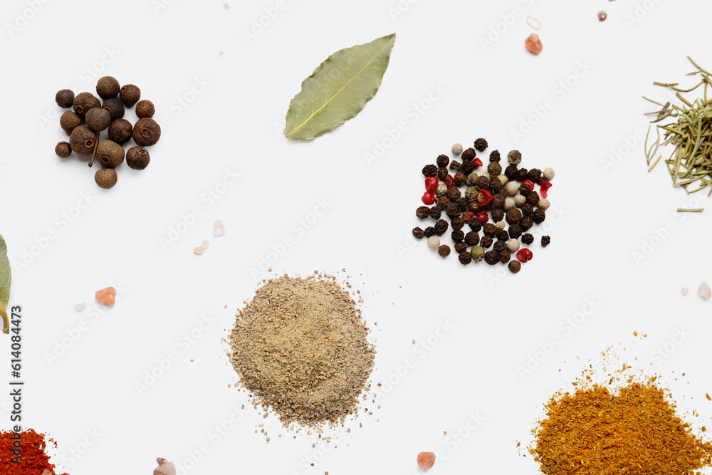 Heaps of aromatic spices on light background