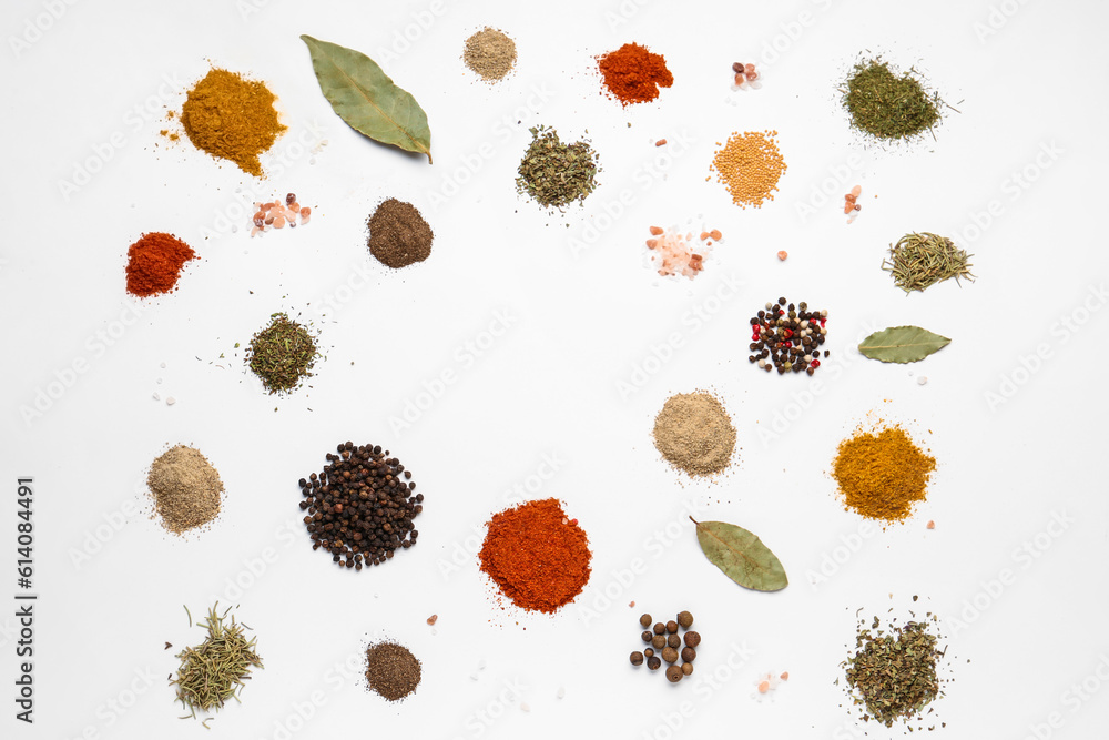 Frame made of fresh aromatic spices on light background