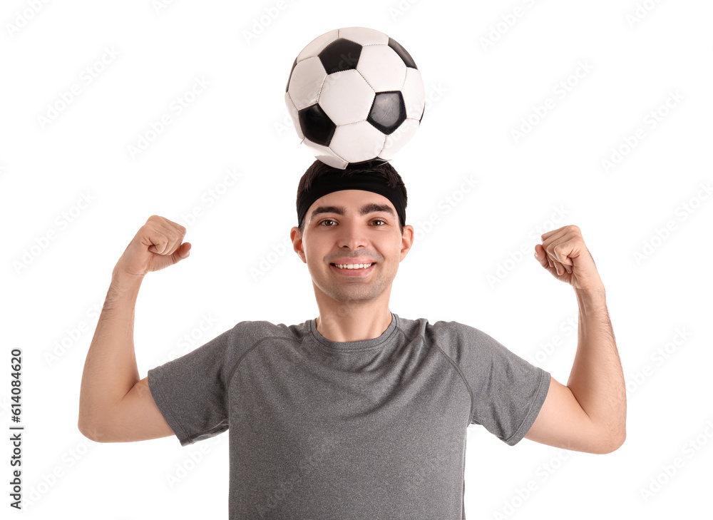 Sporty young man with soccer ball on white background. Balance concept