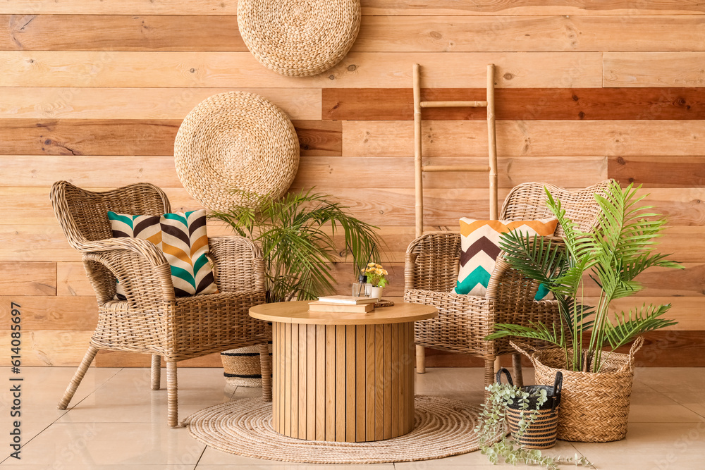 Interior of stylish living room with wicker armchairs and coffee table