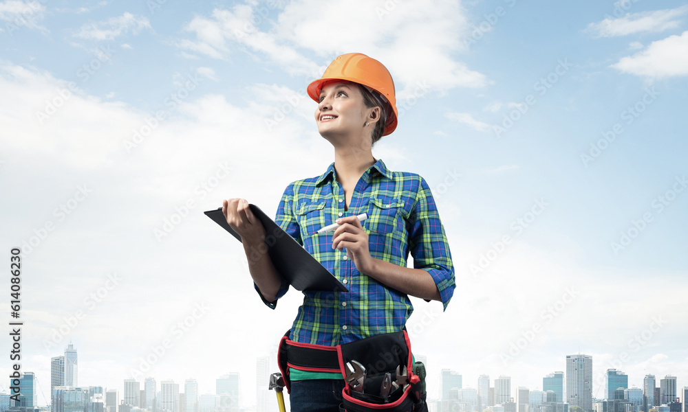 Young building inspector checking outdoor