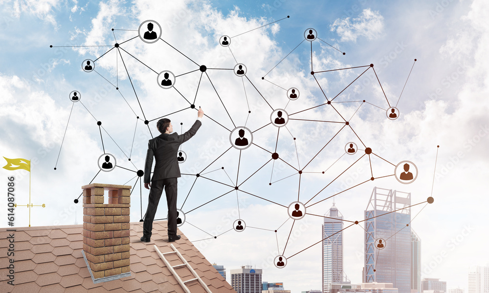 Businessman on house roof presenting networking and connection concept. Mixed media