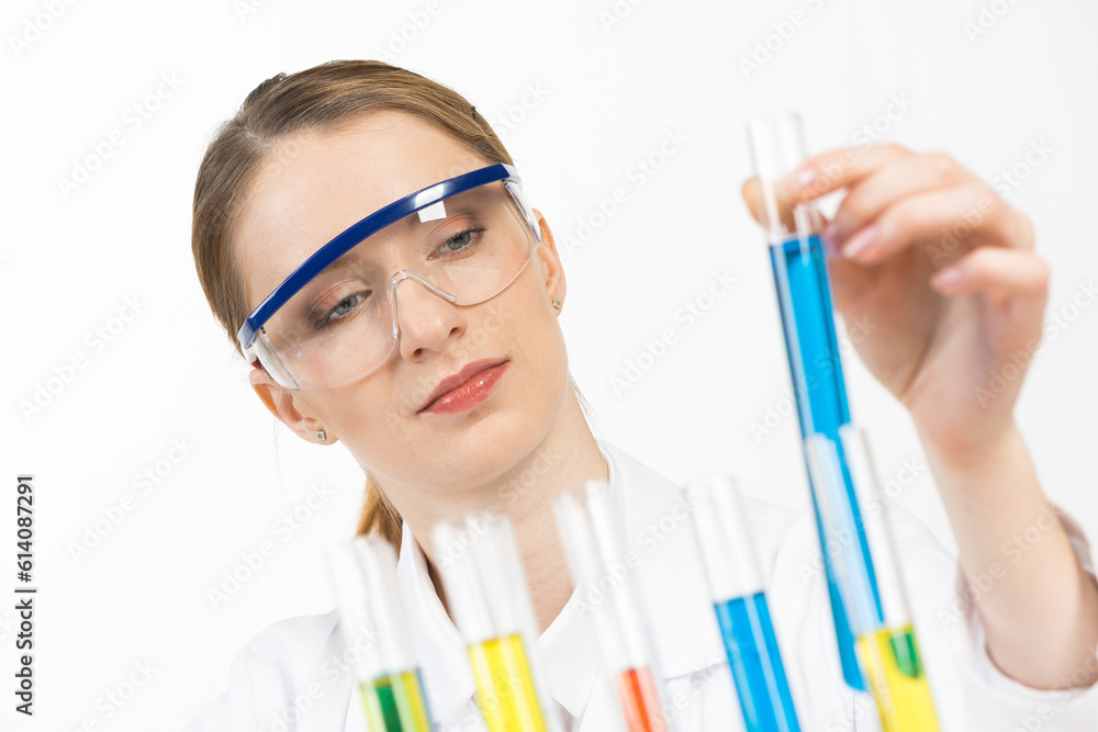 Beautiful woman scientist in protective goggles