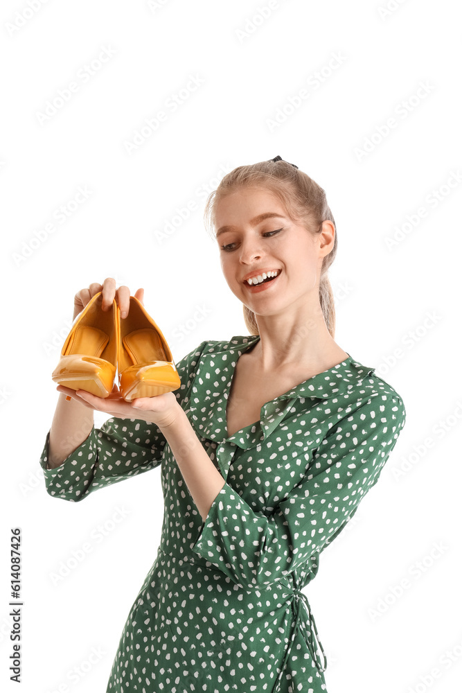 Young woman with shoes on white background