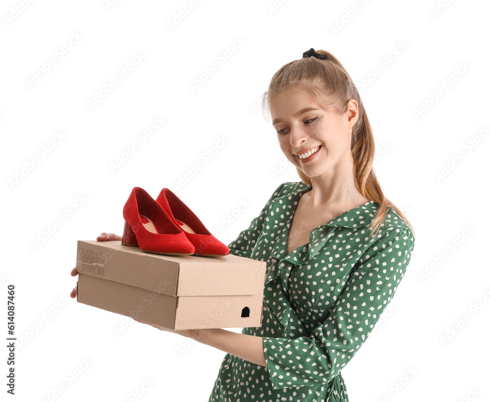 Young woman with shoes on white background