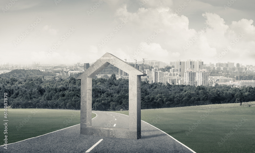 Conceptual background image of concrete home sign on asphalt road