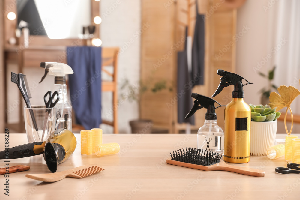 Different hairdressing tools on table in beauty salon