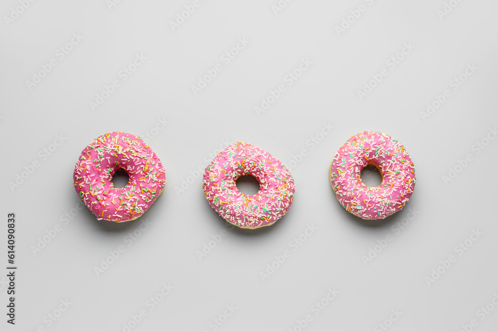 Sweet donuts on grey background