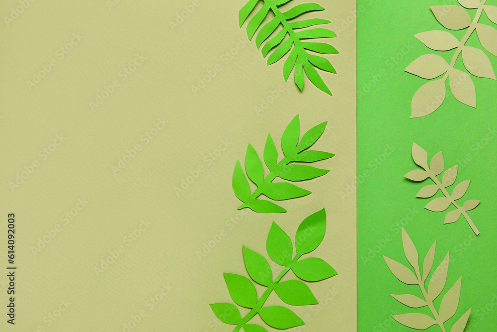 Beautiful origami leaves on color background