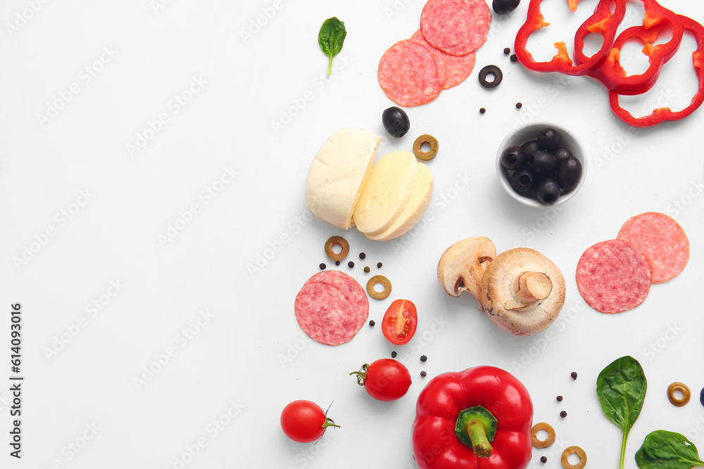 Fresh ingredients for preparing pizza on white background