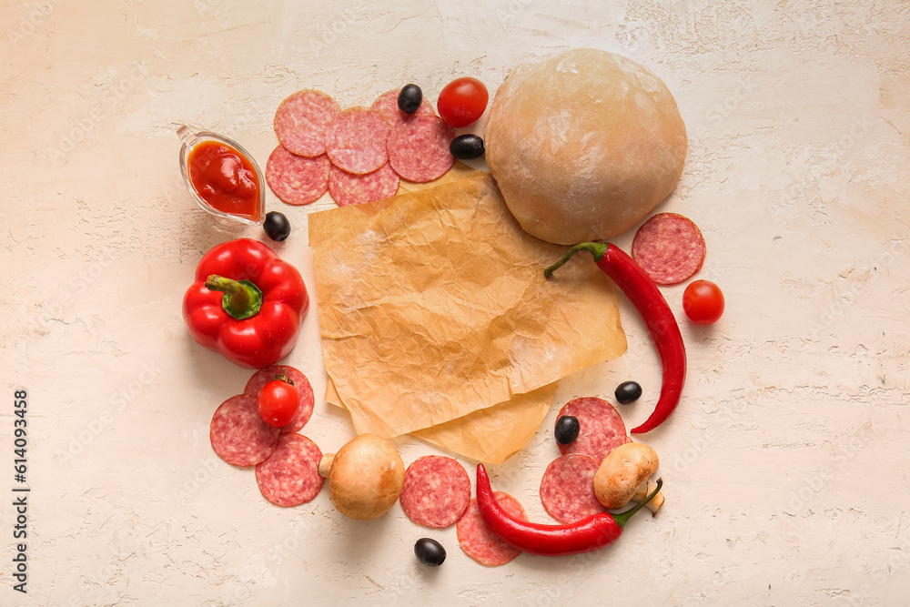 Different ingredients for preparing pizza on light background