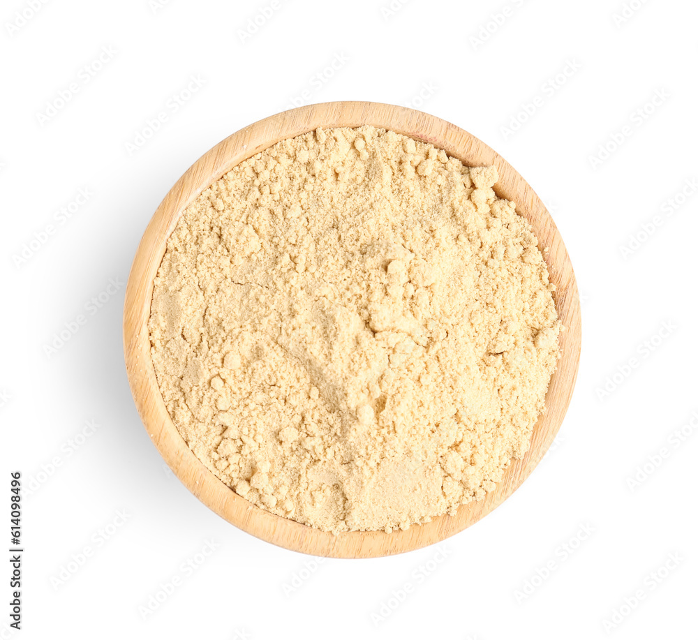 Wooden bowl with sesame flour on white background