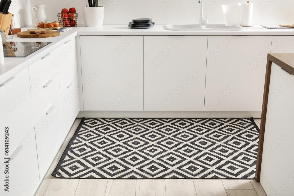 Stylish carpet in interior of modern kitchen