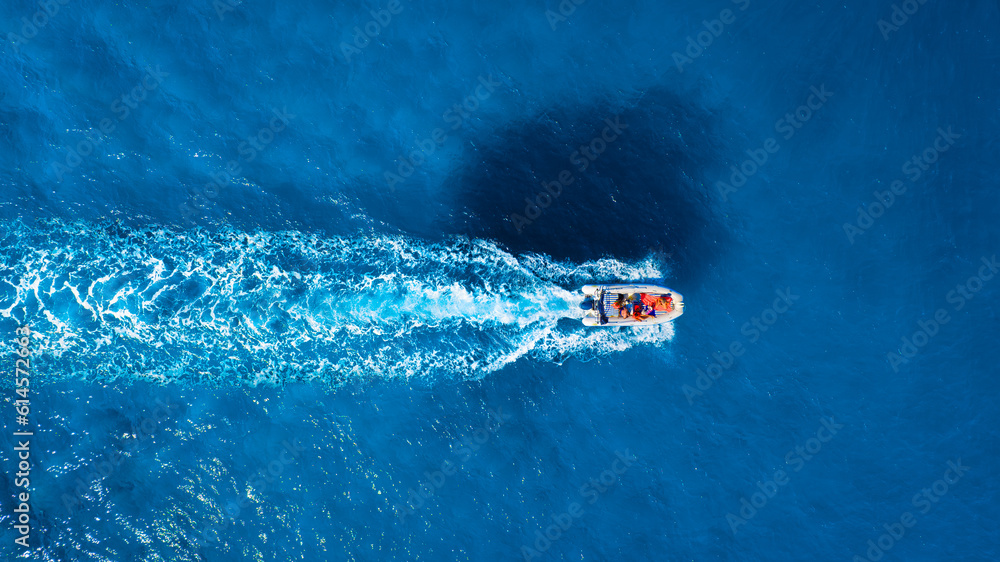 Vacation and leisure. Aerial view on fast boat on blue Mediterranean sea at sunny day. Fast ship on 