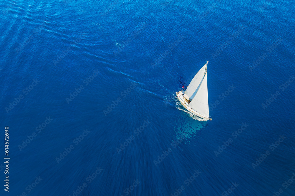 Drone view of a sailing yacht. Luxury transportation. Vacationing people. Vacation and holidays. Sum