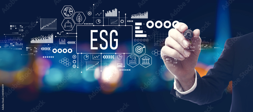 ESG - Environmental, Social and Governance concept with businessman in a city at night