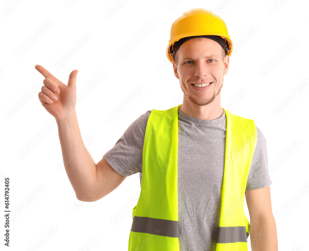 Male worker in vest and hardhat pointing at something on white background