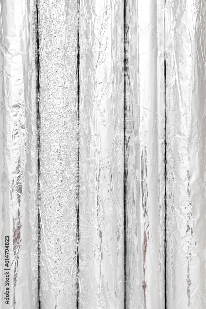 Rolls of aluminium foil as background, closeup