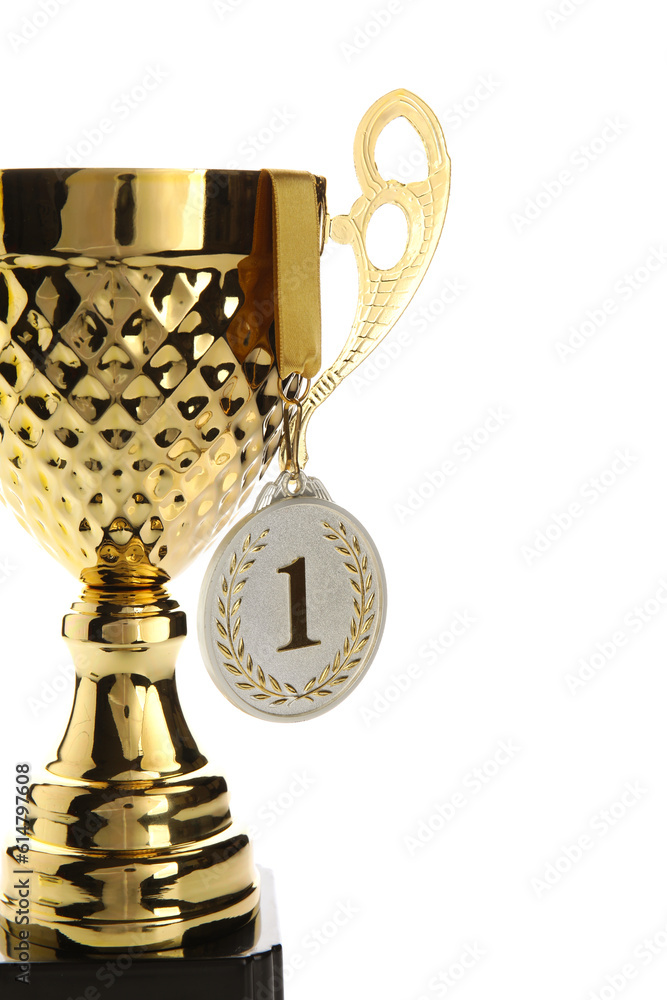 Gold cup with first place medal on white background, closeup