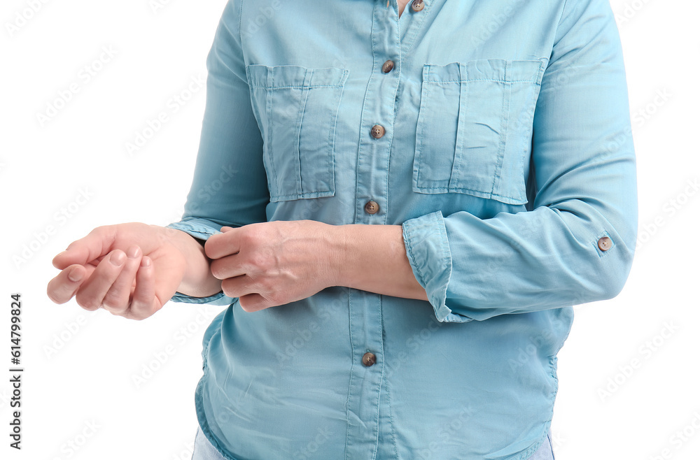 Mature woman rolling up her sleeve on white background, closeup