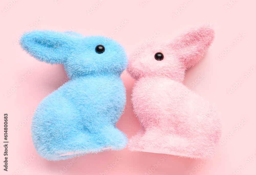 Cute bunnies for Friendship Day on pink background