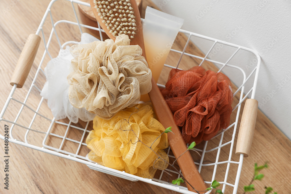 Basket with bath accessories on table, closeup