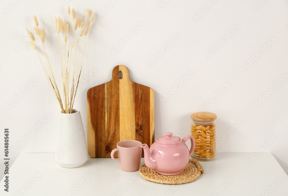 Composition with beautiful tea set and different items on white table