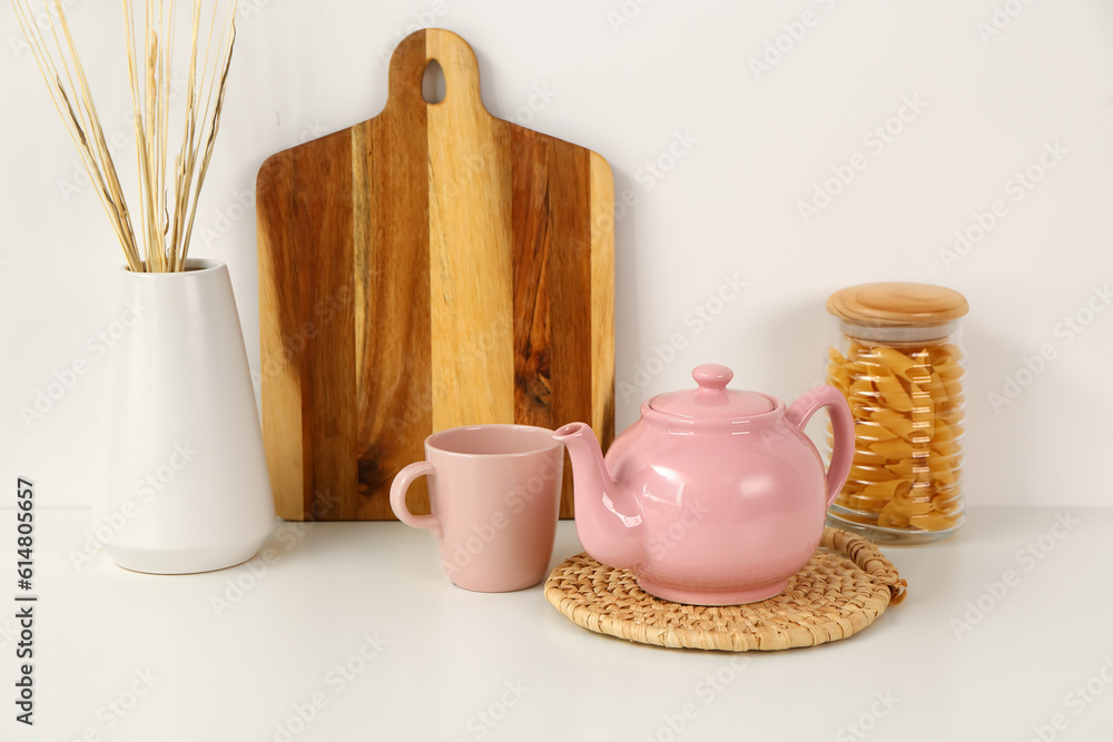 Composition with beautiful tea set and different items on white table