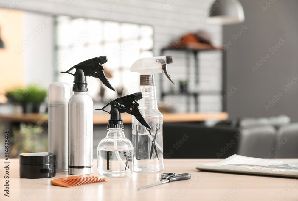 Different hairdressing tools on table in beauty salon