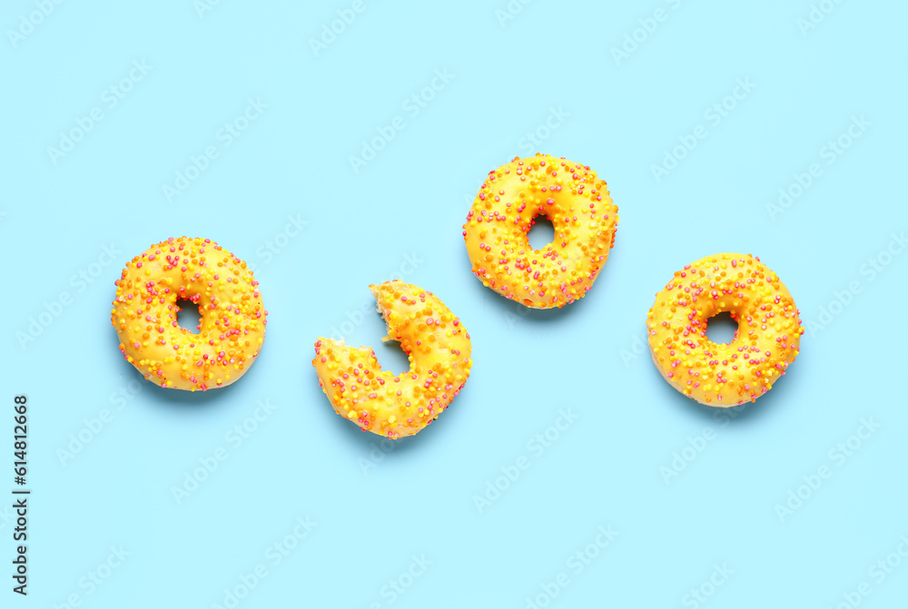 Sweet donuts on blue background