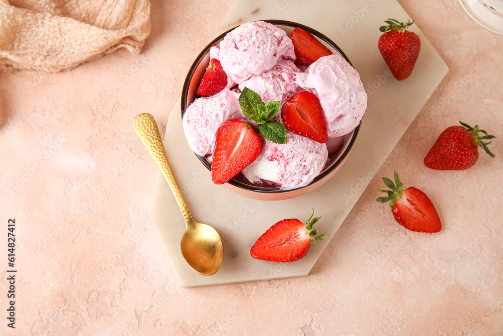 Bowl of delicious ice cream scoops with fresh strawberries and mint on pink table