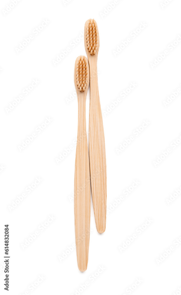 Bamboo toothbrushes on white background