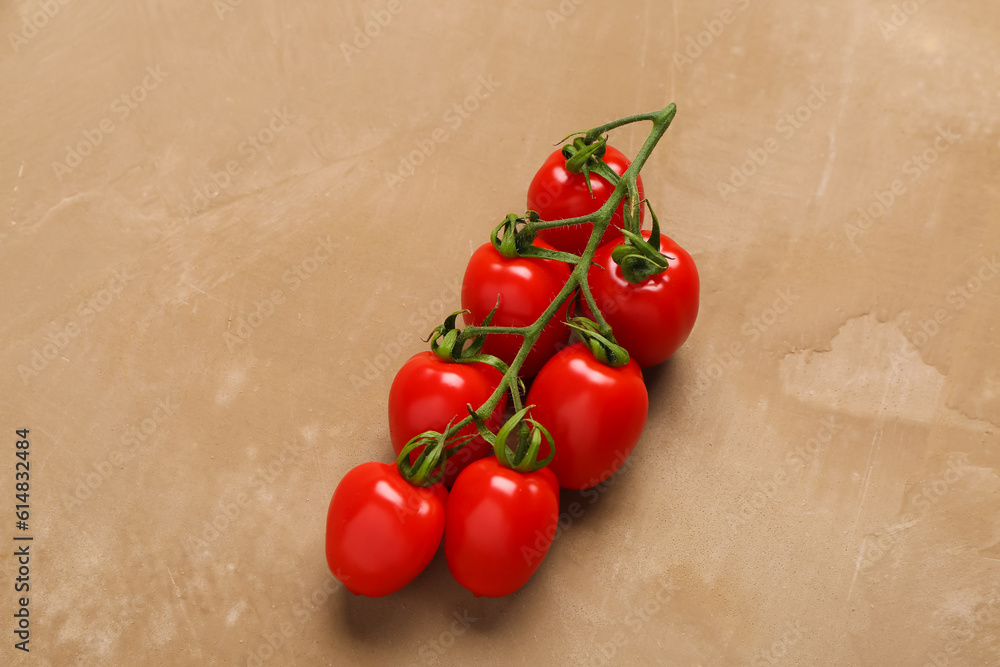 Fresh cherry tomatoes on brown background