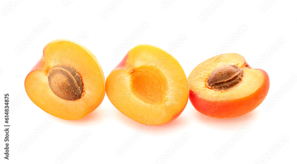 Halves of ripe apricot isolated on white background