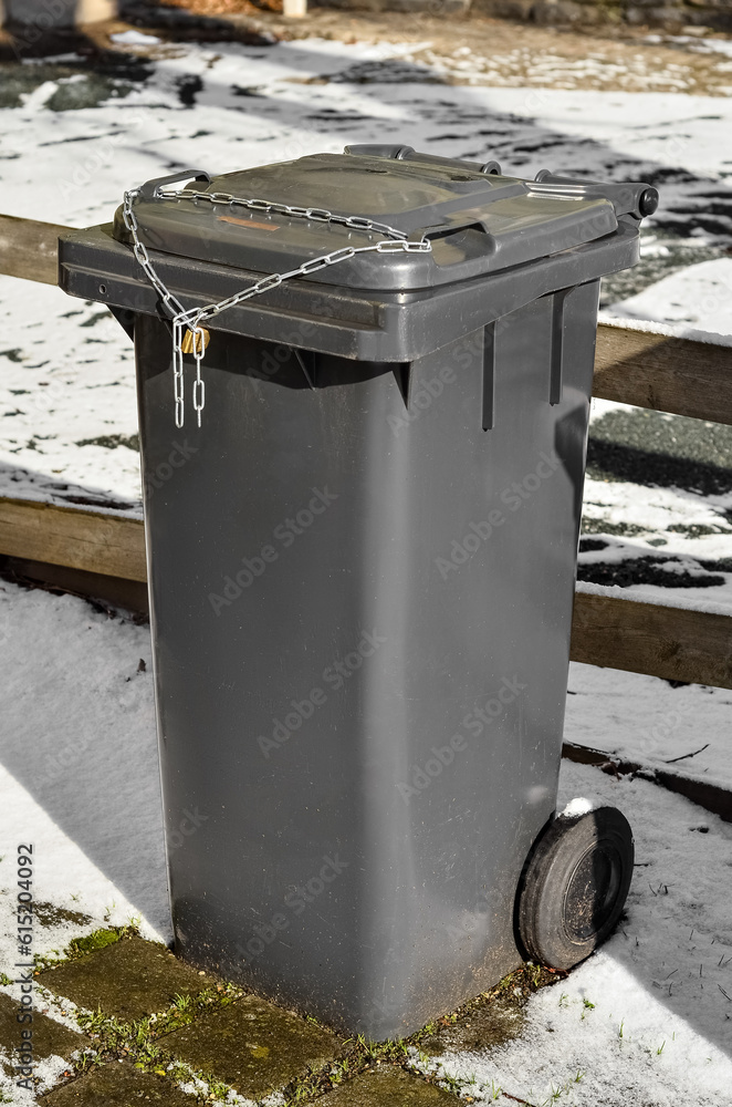 View of garbage container in city on winter day