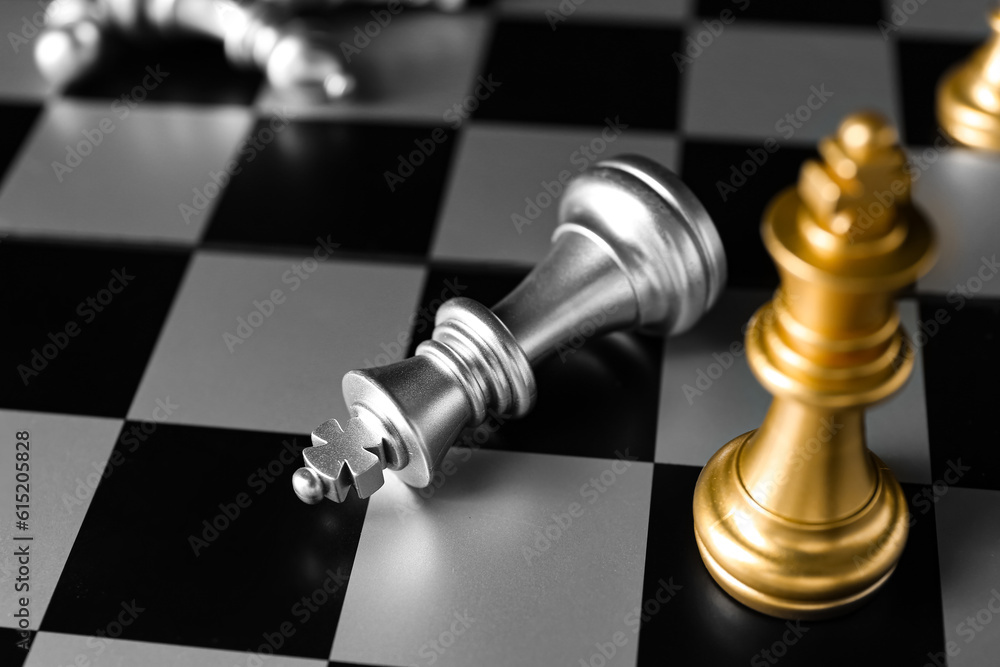 Chess pieces on board, closeup. Loser concept