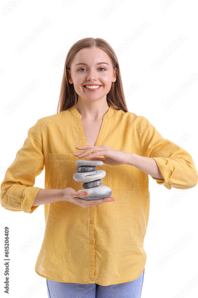 Young woman with spa stones on white background. Balance concept