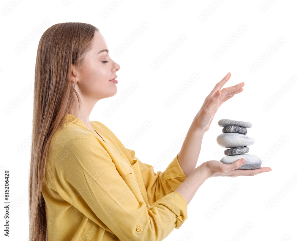 Young woman with spa stones on white background. Balance concept