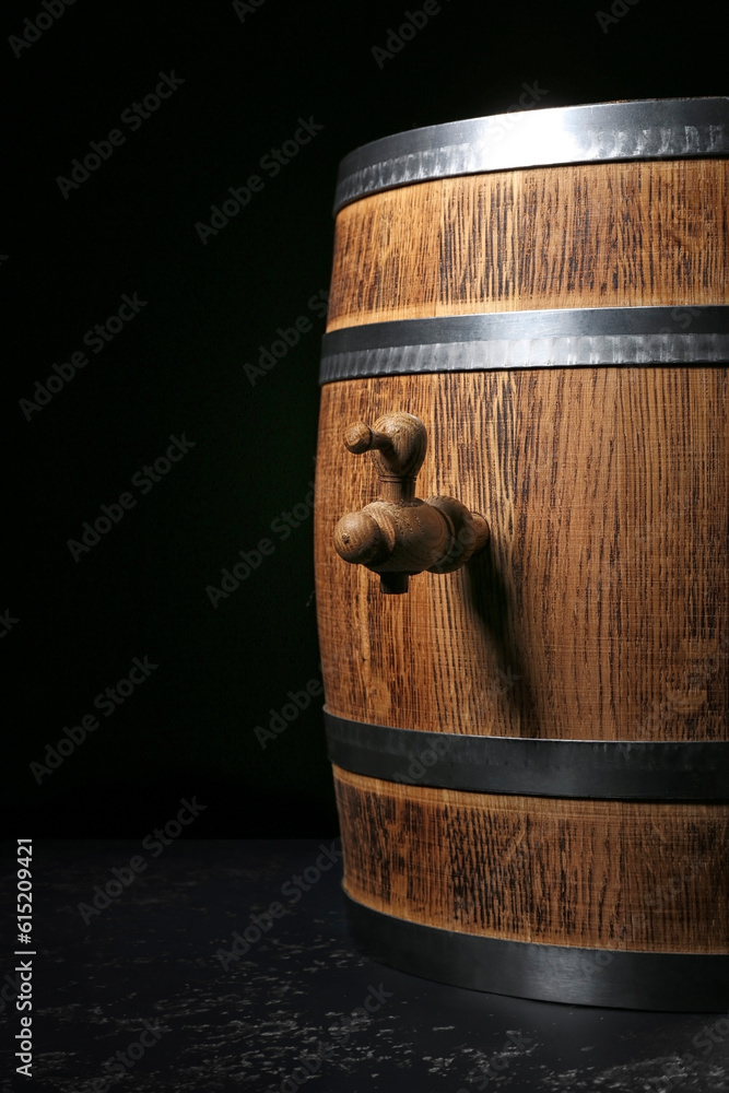 Wooden barrel on dark background