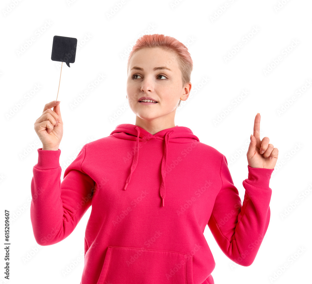 Young woman with speech bubble pointing at something on white background