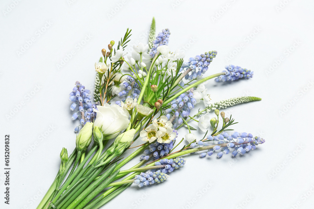 Beautiful bouquet with different flowers on grey background