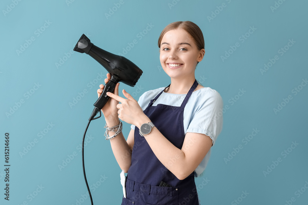 Female hairdresser on blue background