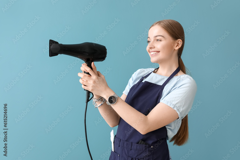 Female hairdresser on blue background