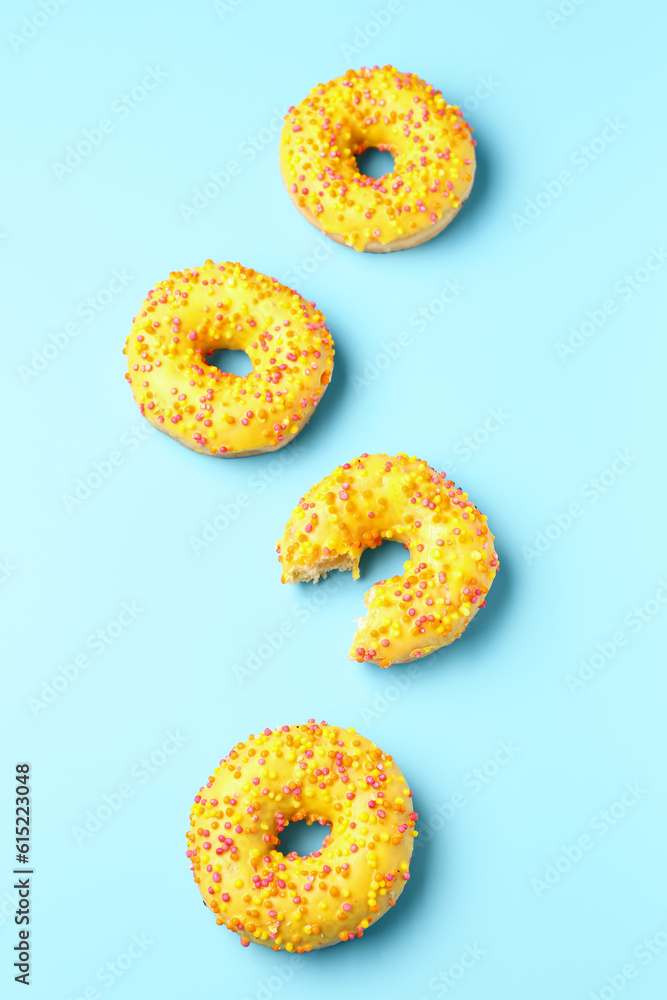 Sweet donuts on blue background