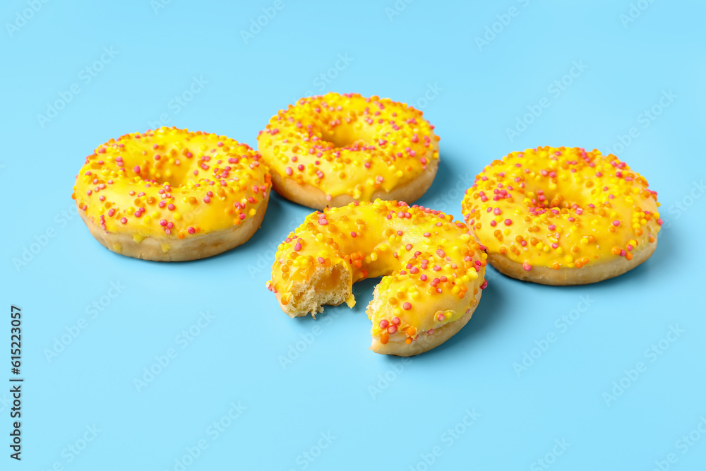 Sweet donuts on blue background